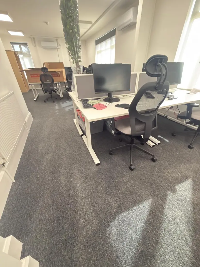 Office desks and floor after commercial cleaning